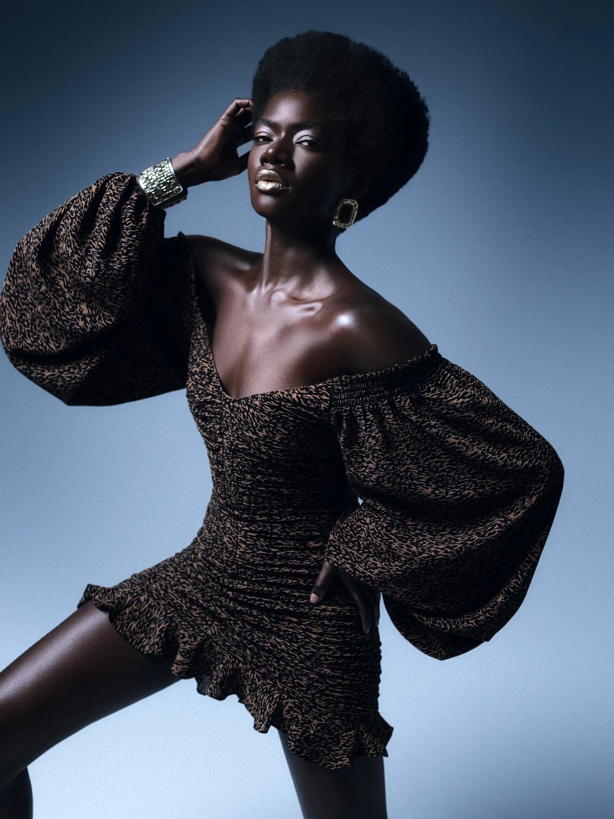Sculptural puff-sleeve dress and statement jewellery
